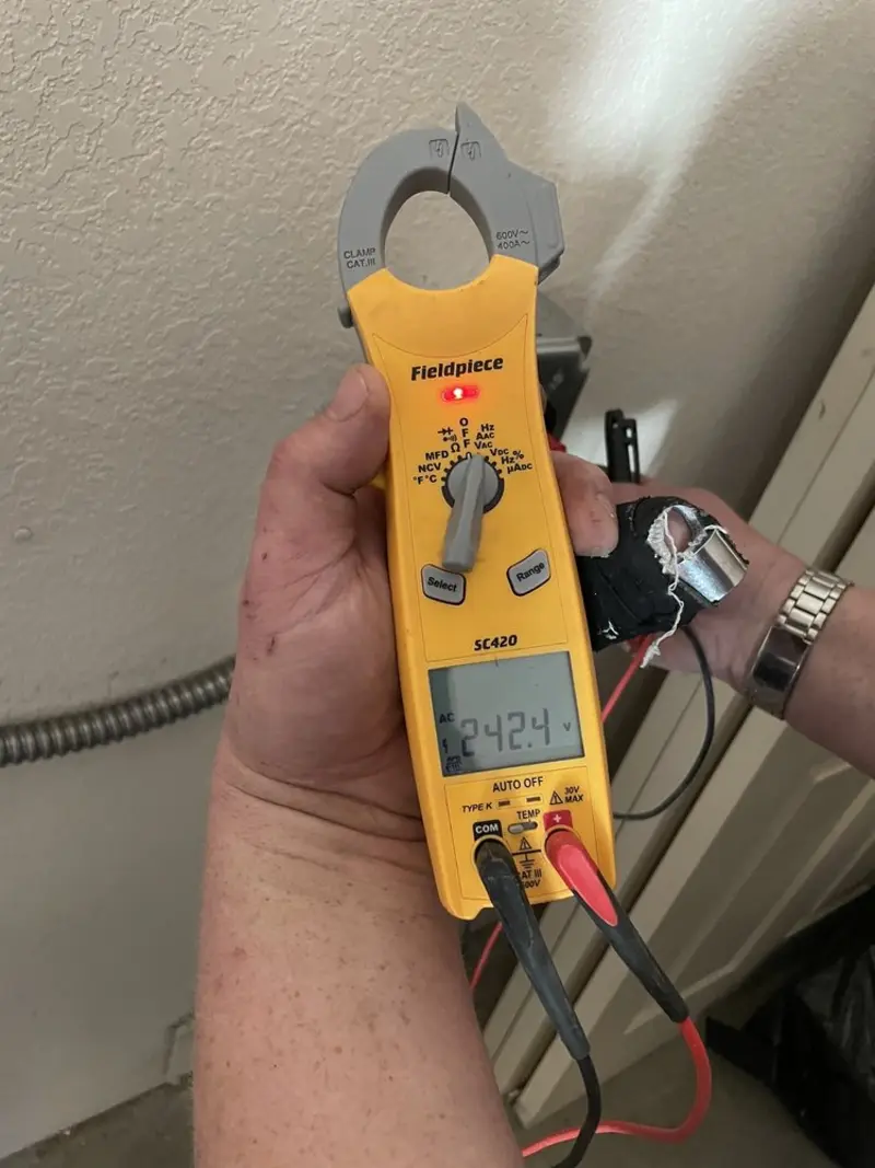 Voltage testing with clamp meter during Generator Installation in Tomah